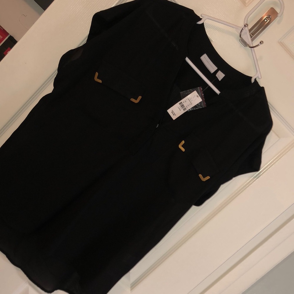 Sheer black dress shirt with metallic designs.